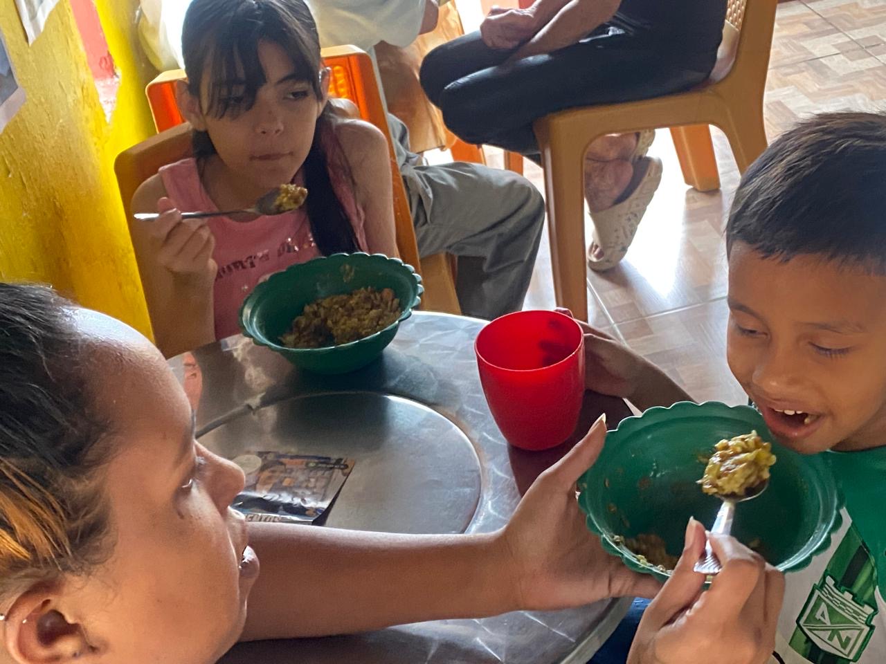 Children being fed during Caribbean mission