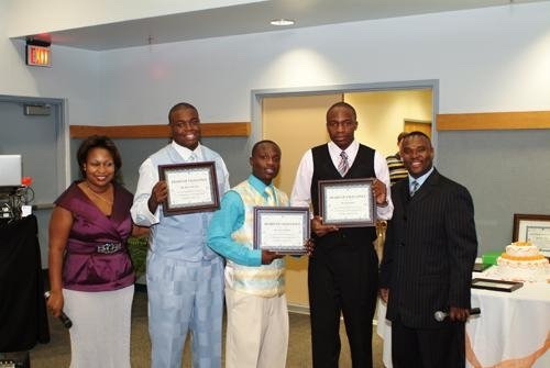 Youth scholarship recipients receiving awards